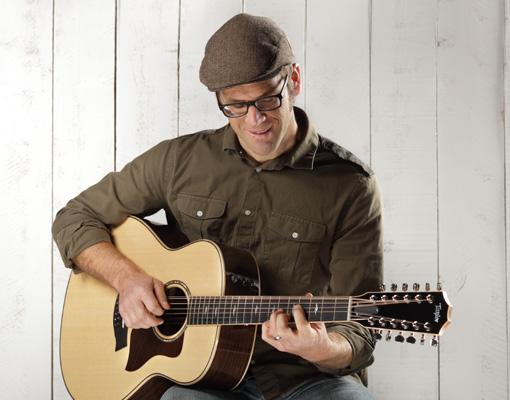 playing a 12 string acoustic guitar